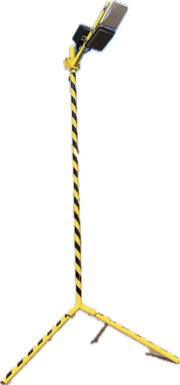 FlaggerAI RFID finish-line reader mounted on a striped tripod stand.